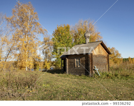 A small wooden church in the Siberian village of Umreva in autumn A small wooden church in the Siberian village of Umreva in autumn 99336292