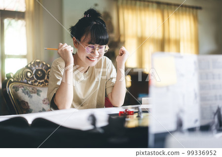 Young adult asian woman enjoying role playing tabletop storytelling and board game with miniatures Young adult asian woman enjoying role playing tabletop storytelling and board game with miniatures 99336952