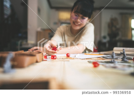 Focus on dice d20 in role playing tabletop and board games hobby concept Focus on dice d20 in role playing tabletop and board games hobby concept 99336958