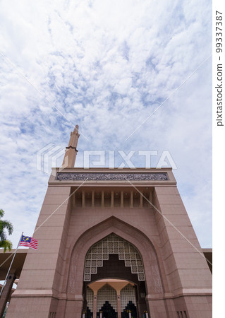 Pink Mosque (Masjid Putra) front gate and minaret in Malaysia 99337387