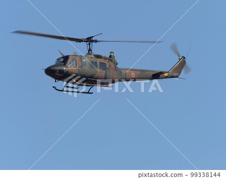 Ground Self-Defense Force utility helicopter in flight Ground Self-Defense Force utility helicopter in flight 99338144
