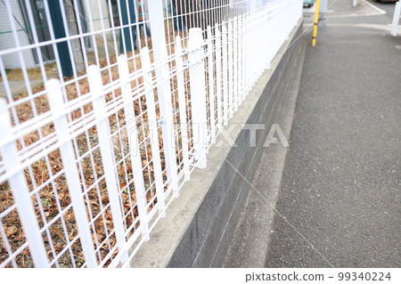 Sidewalks, iron net fences and stone walls Sidewalks, iron net fences and stone walls 99340224