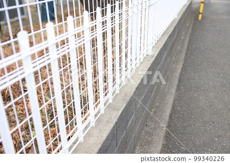 Sidewalks, iron net fences and stone walls Sidewalks, iron net fences and stone walls 99340226
