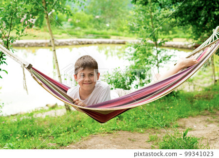 boy in a hammock on the nature boy in a hammock on the nature 99341023