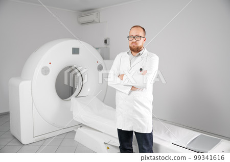Portrait of doctor with medical computed tomography or MRI scanner. Concept of medicine, healthcare and modern diagnostics. Portrait of doctor with medical computed tomography or MRI scanner. Concept of medicine, healthcare and modern diagnostics. 99341616
