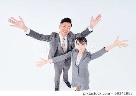 Men and women in suits posing positively Men and women in suits posing positively 99341992