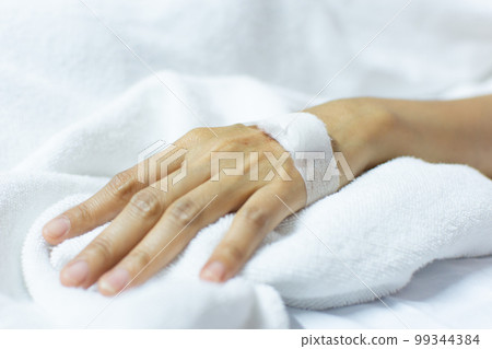 Patient with saline intravenous in the hospital 99344384