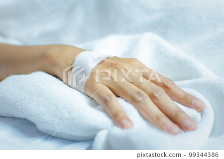 Patient with saline intravenous in the hospital 99344386