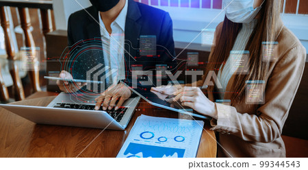 Businessman hand Project manager working and update tasks and Gantt chart scheduling virtual diagram.with smart phone, tablet and laptop in office.. 99344543