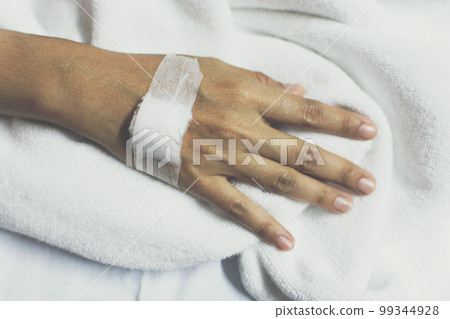 Patient with saline intravenous in the hospital 99344928