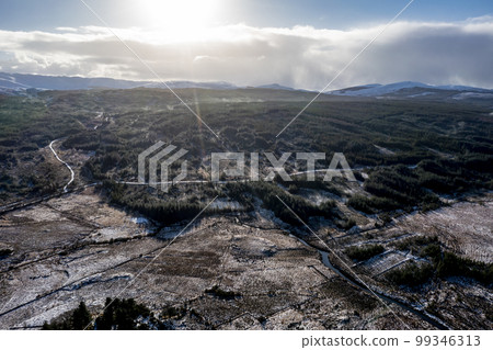 Aerial view of snow covered Gweebarra River between Doochary and Lettermacaward in Donegal - Ireland - The site of the new Cloughercor wind farm in the background Aerial view of snow covered Gweebarra River between Doochary and Lettermacaward in Donegal - Ireland - The site of the new Cloughercor wind farm in the background 99346313