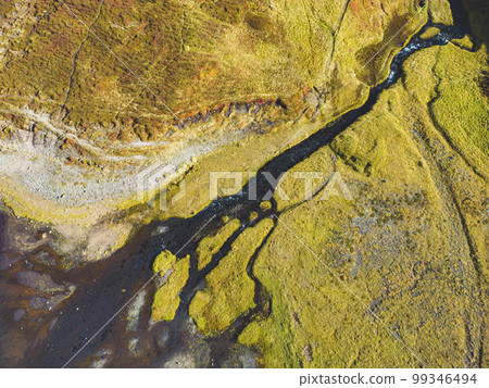 Aerial view of river running down into a small waterfall - Iceland, autumn 2022 99346494