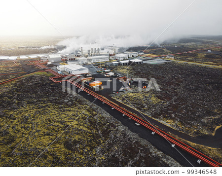 Large geothermal power plant in Iceland, stem coming out of the chimneys of the power plant  99346548
