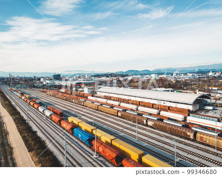 Colorful cargo trains, aerial view, trains standing at the railway station  99346680