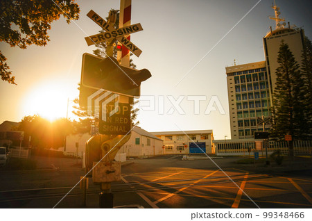 Australian railroad crossing and sunset Australian railroad crossing and sunset 99348466