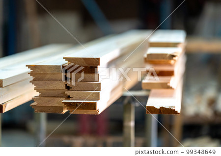 wooden boards on a rack in a carpentry shop 99348649