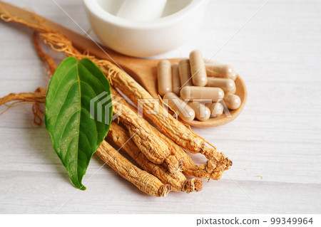 Ginseng roots and green leaf, healthy food. Ginseng roots and green leaf, healthy food. 99349964