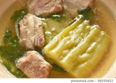 boiled bitter melon with  pork bone in clear soup on bowl 99350852