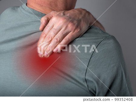 Man suffering from shoulder blade pain. Trigger point. Hand holding shoulder with red point closeup. Back injury. Health care, joint diseases concept 99352408