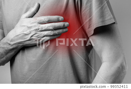 Man suffering from heart pain. Hand holding red painful point closeup. Heart attack, infarct, palpitation. Health care, medicine concept. Man suffering from heart pain. Hand holding red painful point closeup. Heart attack, infarct, palpitation. Health care, medicine concept. 99352411