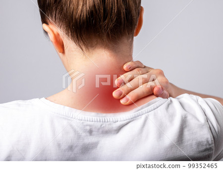 Woman suffering from neck pain. Hand holding painful neck with red spot closeup. Muscle spasm. Health care, medicine concept. Sedentary lifestyle. 99352465