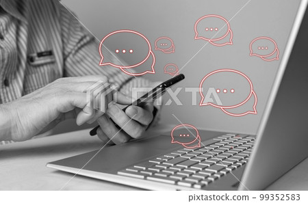 Man using phone for responding to negative feedback and reviews, bad comments, customers claims and complaints. Male sitting at table with laptop. Black and white 99352583