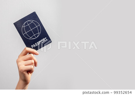 Banner with woman hand holding passport on violet background. Travel concept. Identity, nationality verification. Copy space 99352654