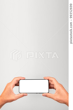Banner with man holding phone mockup in horizontal position. Male using smartphone for watching video. template with blank display. Place for text Banner with man holding phone mockup in horizontal position. Male using smartphone for watching video. template with blank display. Place for text 99352699
