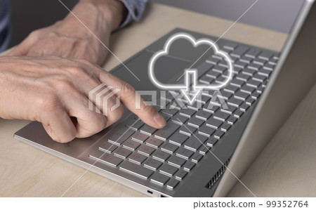 Cloud computing. Man using laptop for download files from remote database. Forefinger closeup pressing on enter button. Online service for storing objects Cloud computing. Man using laptop for download files from remote database. Forefinger closeup pressing on enter button. Online service for storing objects 99352764