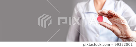 Banner with doctor holding birth control pill or tablet for painful menstruation cramps, menstrual cycle regulation. Medication prescription, contraception concept. Copy space 99352801