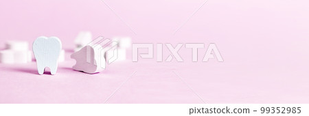 Banner with white beautiful teeth on pink background. Oral hygiene, stomatology, caries and periodontal disease prevention concept. Copy space 99352985