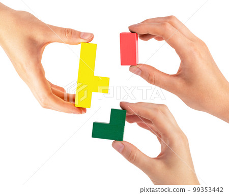 Hands joining puzzle pieces isolated on white background. Teamwork, partnership concept. Help and support among colleagues, teambuilding. 99353442