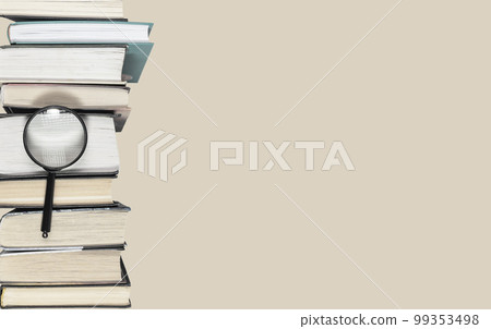 Banner with large books heap and magnifier. Research conducting, important data search, information analysis, preparing for exams concept. Copy space on pastel background 99353498