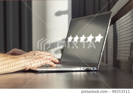 Man using laptop for giving positive feedback. Five star rating of service quality, application, film. Excellent customer experience, satisfaction. Hands on computer keyboard closeup. 99353511