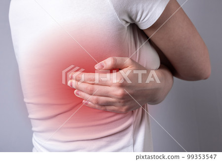 Intercostal neuralgia. Woman suffering from backache with red spot closeup. Pain under blade shade. Health care concept Intercostal neuralgia. Woman suffering from backache with red spot closeup. Pain under blade shade. Health care concept 99353547