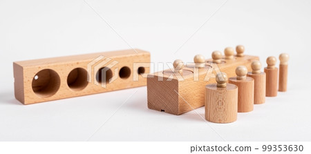 Montessori knobbed wooden cylinders with blocks. Children puzzle for development of dimension perception 99353630