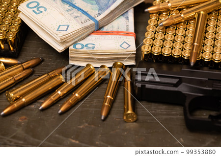 A gun along with a supply of ammunition during a financial transaction. 99353880