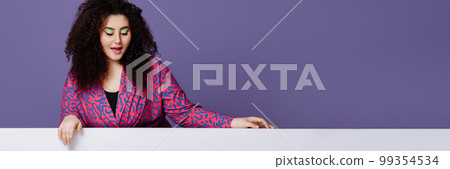 Banner woman leans her hands on an empty space for text on a purple background. Banner woman leans her hands on an empty space for text on a purple background. 99354534