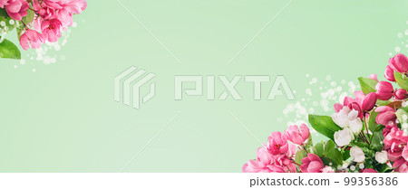 Spring blossom, branches of magenta blossoming red cherry full frame. Pink sakura or fruit tree viva flowers, copy space garden border banner. 99356386