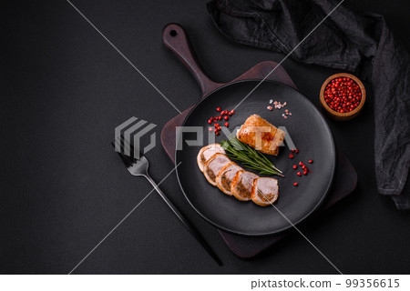 Delicious chicken or pork meat roll with mushrooms, cheese, spices and herbs 99356615