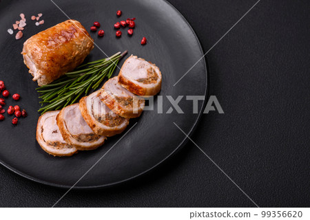 Delicious chicken or pork meat roll with mushrooms, cheese, spices and herbs Delicious chicken or pork meat roll with mushrooms, cheese, spices and herbs 99356620