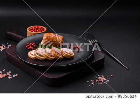 Delicious chicken or pork meat roll with mushrooms, cheese, spices and herbs Delicious chicken or pork meat roll with mushrooms, cheese, spices and herbs 99356624