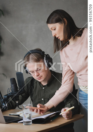 man and woman in studio record podcast, create audio content, advertising message. 99356709