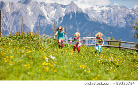 Children hiking in Alps mountains. Kids outdoor. Children hiking in Alps mountains. Kids outdoor. 99356784
