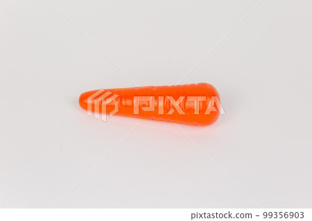 yellow carrot on a white background children's toy yellow carrot on a white background children's toy 99356903