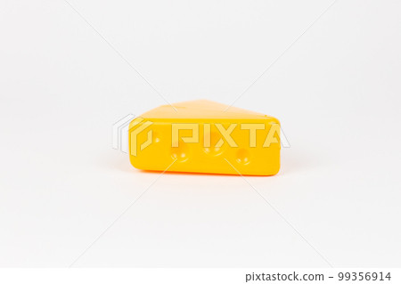 toy plastic piece of masdam cheese on a white background 99356914