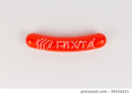 plastic sausage grill children's toy on a white background 99356915