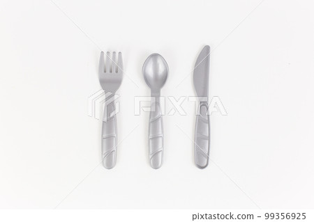 plastic table utensils bottom saw spoon on a white background 99356925