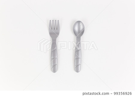 plastic table utensils bottom saw spoon on a white background plastic table utensils bottom saw spoon on a white background 99356926