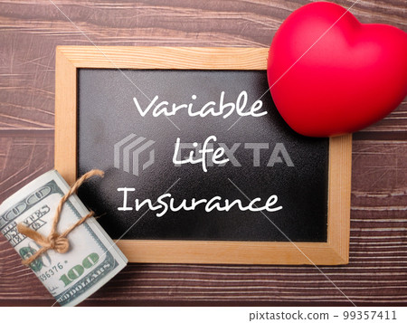 Red heart and banknotes with the word Variable Life Insurance. Business concept. Red heart and banknotes with the word Variable Life Insurance. Business concept. 99357411